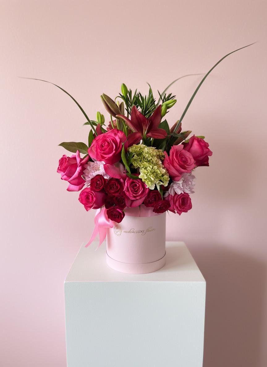 Round pink hat box arrangement — Modern LUXE Flowers Chicago
