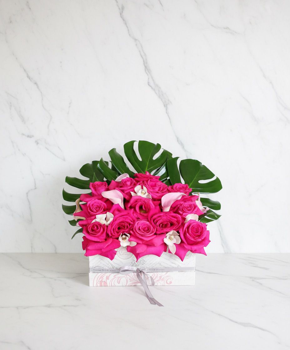 Flat square box with pink roses and monstera — Modern LUXE Flowers Chicago